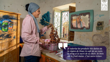 Woman in the kitchen looking into a mirror